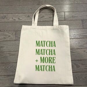 Stylish Cream Tote with Green Text